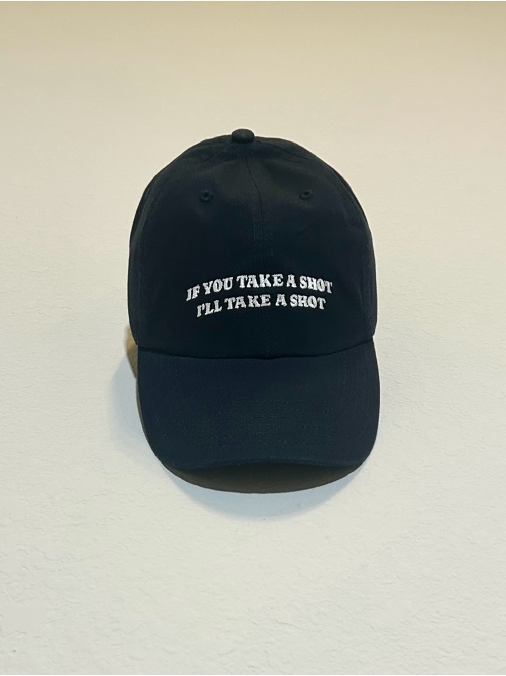 Black Baseball Cap with White Embroidered Text